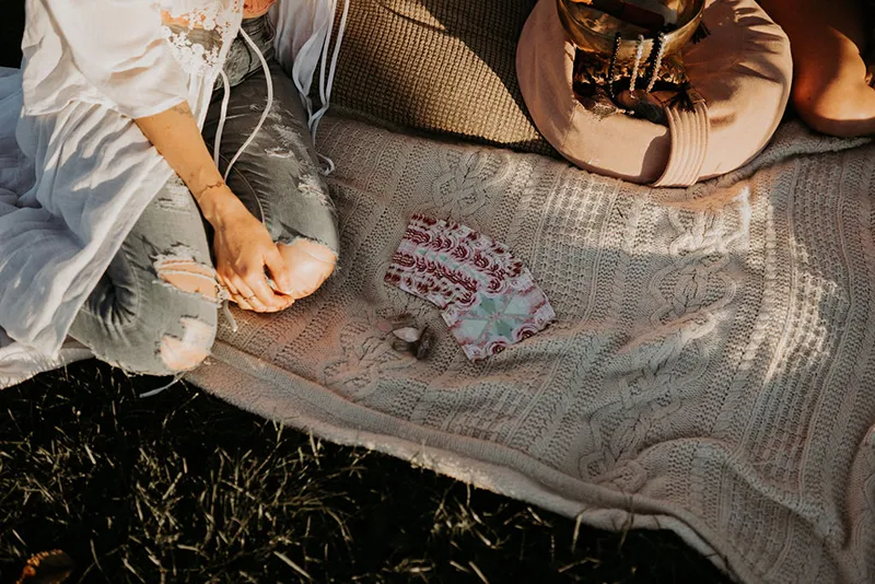 Oracle cards on a blanket outdoors